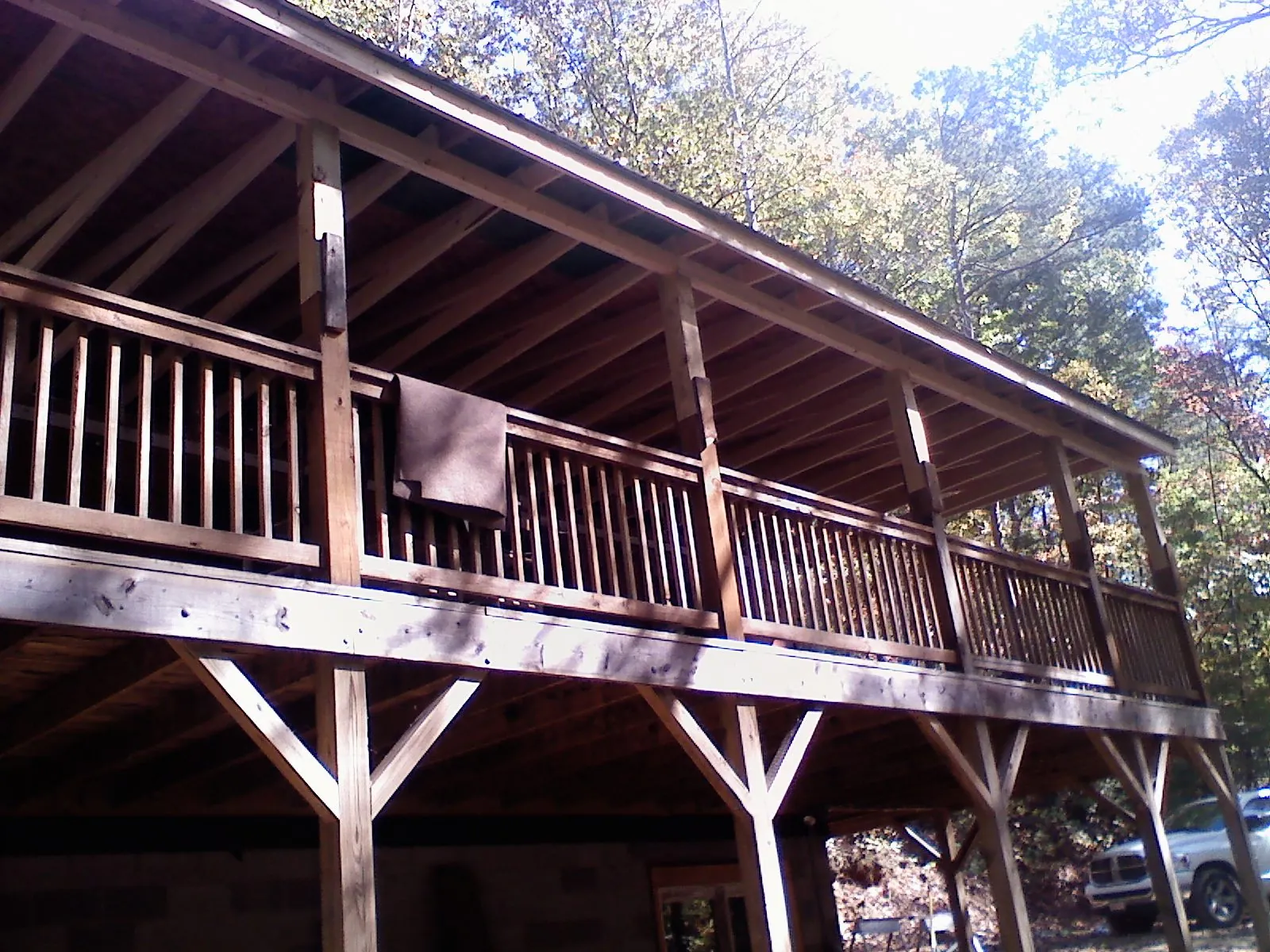 Timber framing under a new elevated porch and deck — Roof Leak Repair in Sodus Point by Roofing Brothers